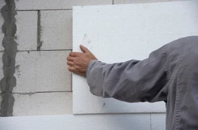 construction-worker-installing-styrofoam-insulation-260nw-2207667287